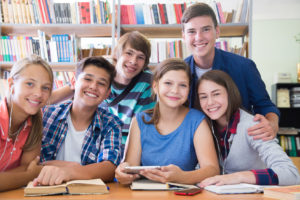 portrait of a group of students in the library